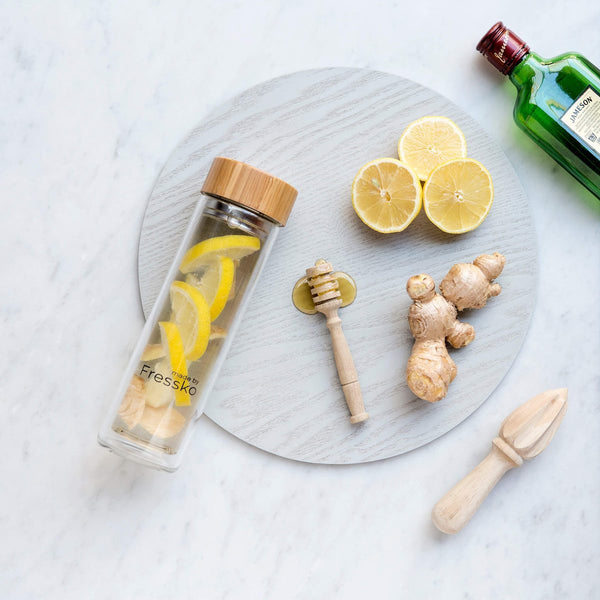 Glass fressko flask with lemon ginger honey and whisky