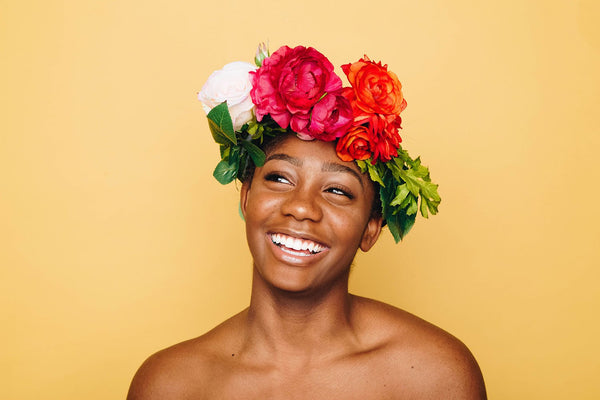 Woman smiling with flowers in hair