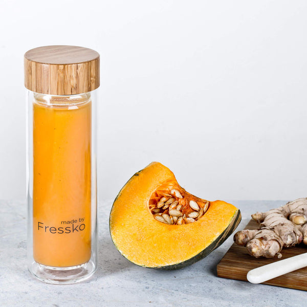 Pumpkin and ginger soup in glass fressko flask with ginger